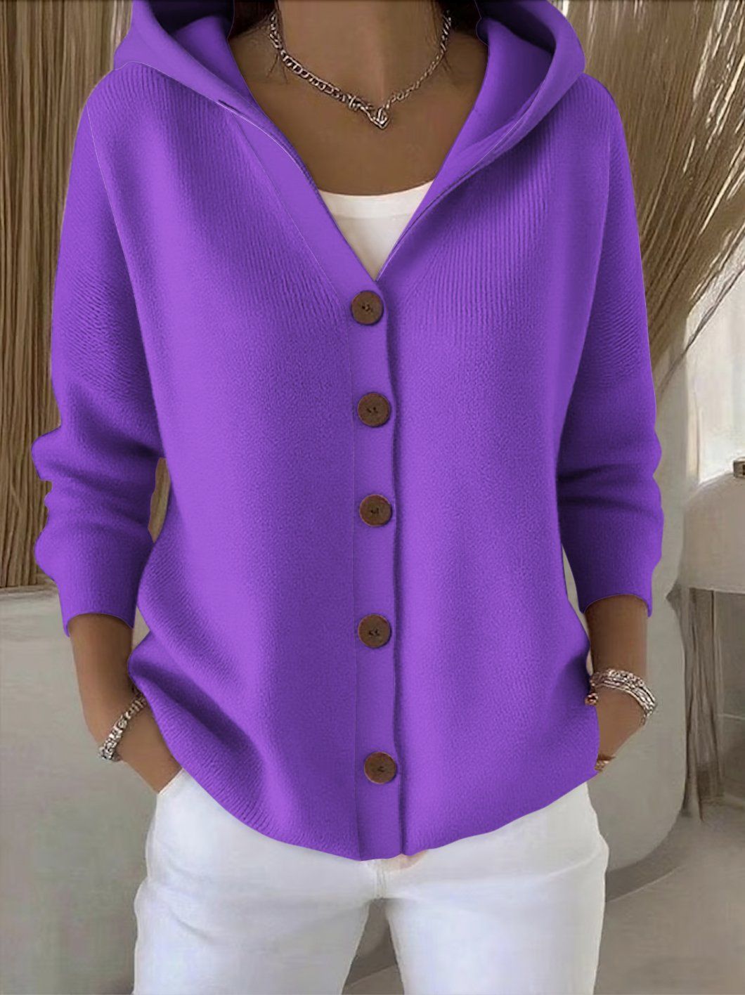 Lightweight women's hooded vest featuring a stylish patchwork design, perfect for layering in transitional weather. 8