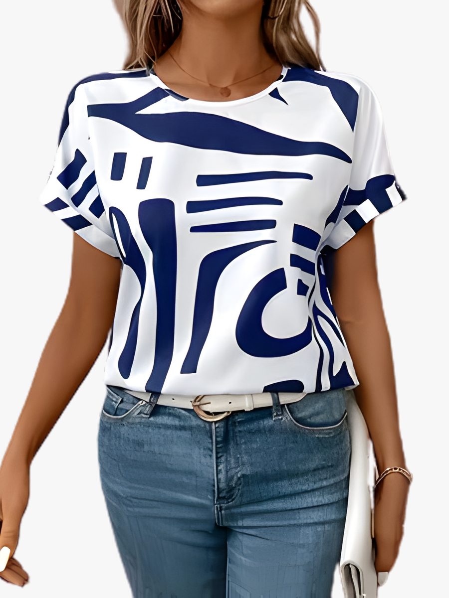 Vela Women's T Shirt featuring an abstract print, made from a comfortable cotton-polyester blend, designed with short sleeves for a stylish and casual look. 1